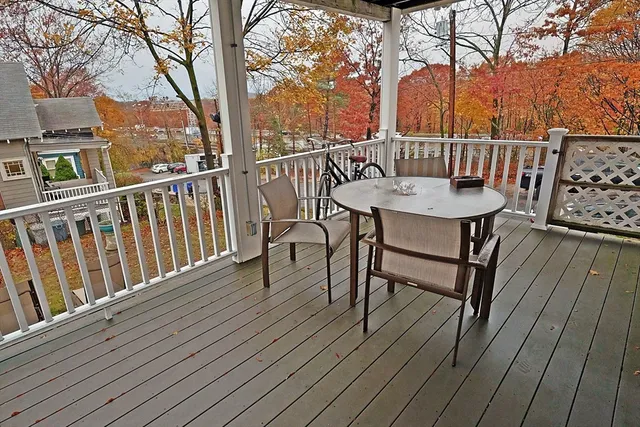 a view of a two chairs on the roof deck