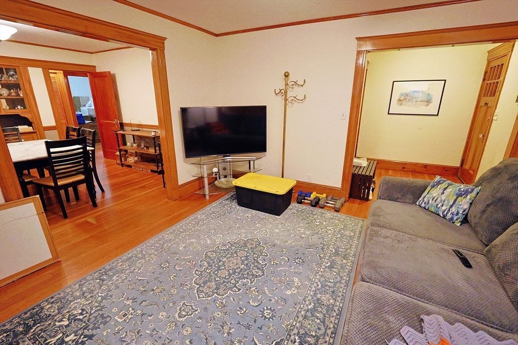 38 Ranelegh Road, Unit 1 Boston, MA 02135 - Photo 2 of 16 a living room with furniture and a flat screen tv
