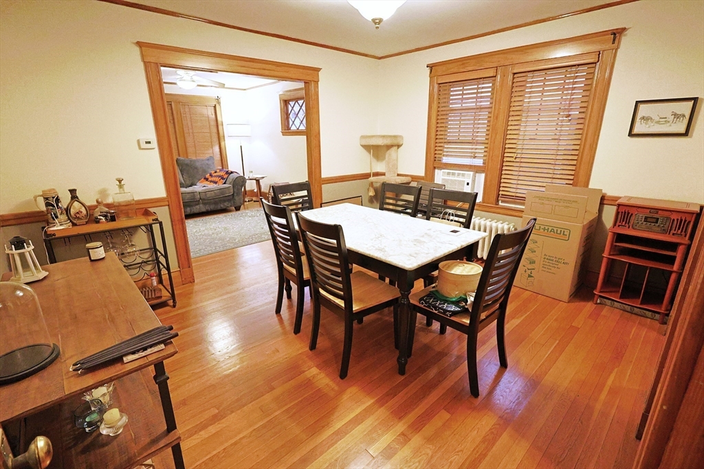 38 Ranelegh Road, Unit 1 Boston, MA 02135 - Photo 3 of 16 a view of a dining room with furniture window and wooden floor