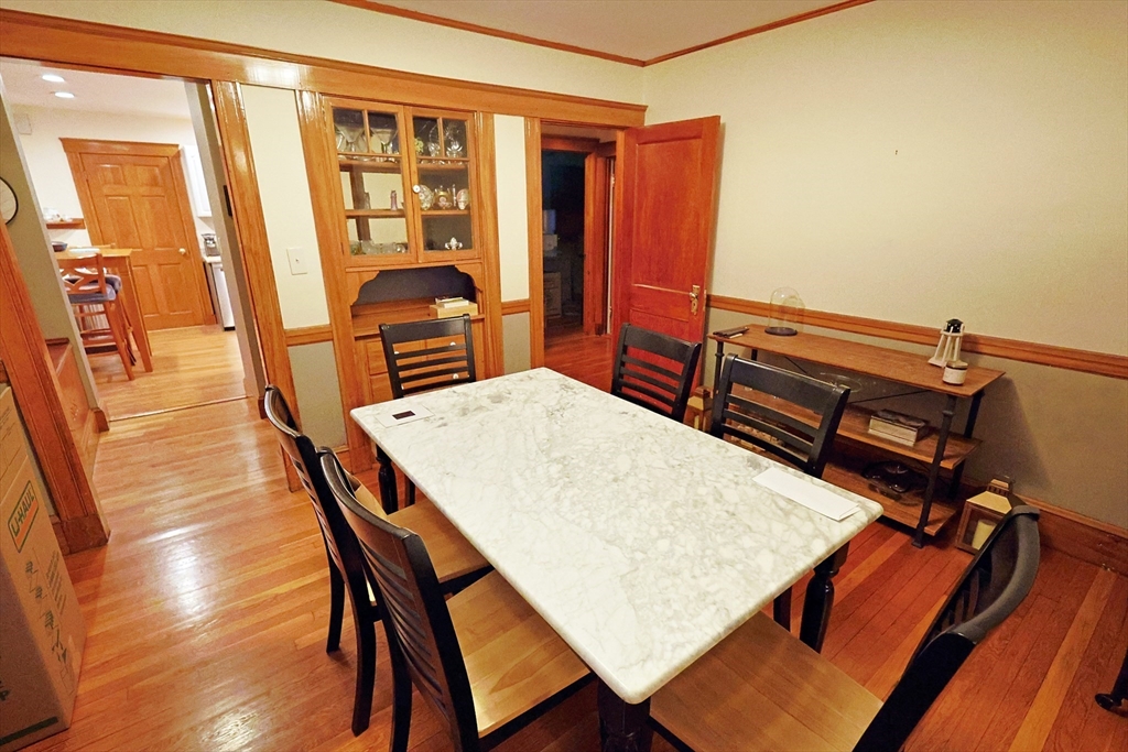 38 Ranelegh Road, Unit 1 Boston, MA 02135 - Photo 5 of 16 a dining room with furniture and wooden floor
