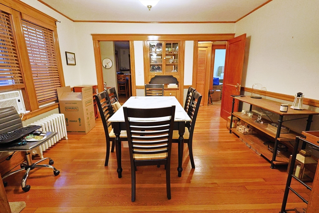 38 Ranelegh Road, Unit 1 Boston, MA 02135 - Photo 6 of 16 a dining room with furniture window and wooden floor