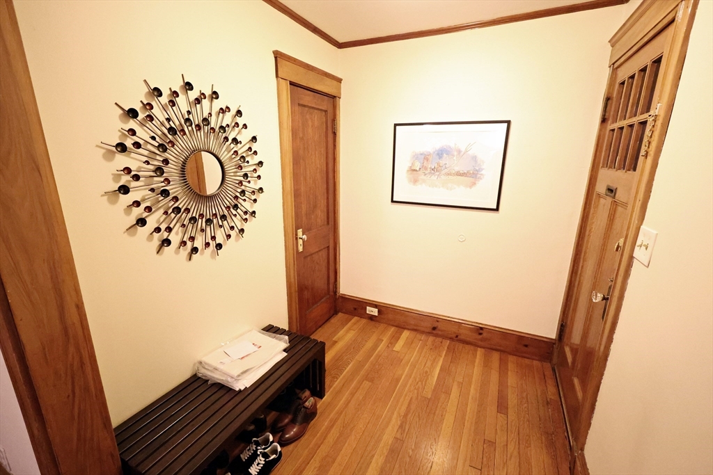 38 Ranelegh Road, Unit 1 Boston, MA 02135 - Photo 7 of 16 a view of a hallway with wooden floor