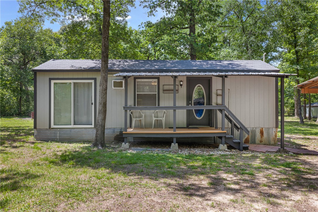 12255 County Road Centerville, TX 75833 - Photo 15 of 26 a front view of house with yard outdoor seating and green space