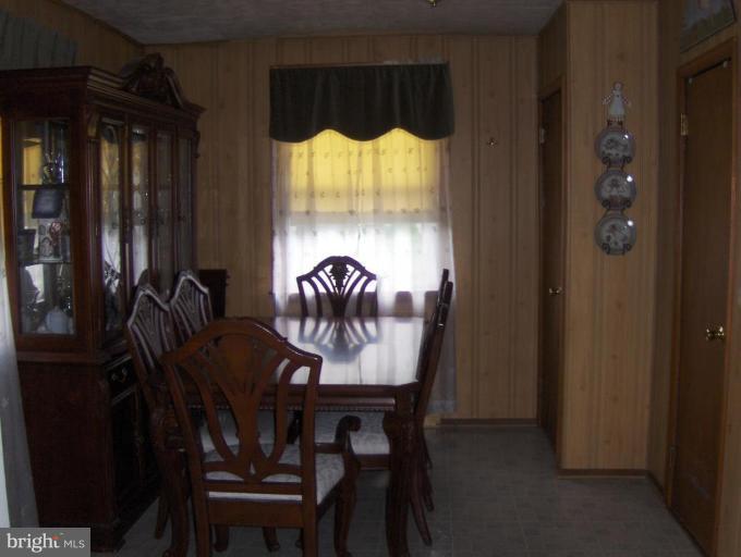 8407 Berkfield Road Rosedale, MD 21237 - Photo 6 of 6 a view of a dining room with furniture window and outside view