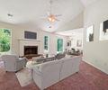 6445 Marsham Drive Atlanta, GA 30349 - Photo 11 of 28 a living room with furniture a fireplace and a flat screen tv