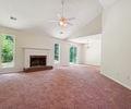 6445 Marsham Drive Atlanta, GA 30349 - Photo 12 of 28 a view of empty room with fireplace and fan