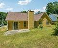 6445 Marsham Drive Atlanta, GA 30349 - Photo 20 of 28 a view of a house with a backyard