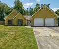6445 Marsham Drive Atlanta, GA 30349 - Photo 2 of 28 a view of a house with a yard