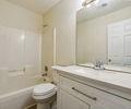 6445 Marsham Drive Atlanta, GA 30349 - Photo 22 of 28 a bathroom with a granite countertop sink a toilet and shower