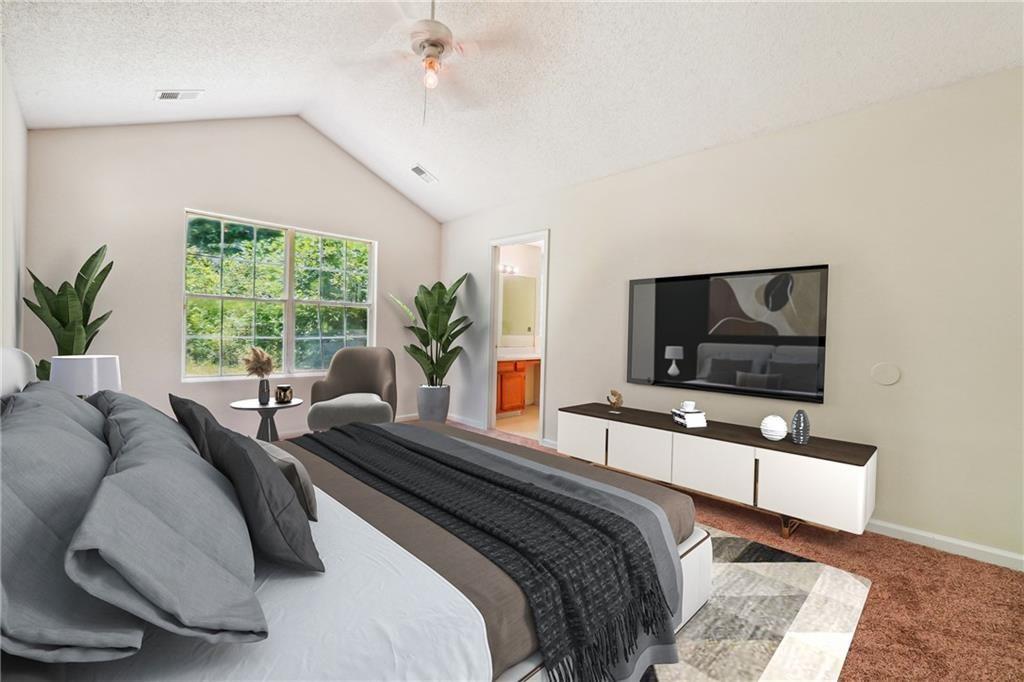 6445 Marsham Drive Atlanta, GA 30349 - Photo 23 of 28 a living room with furniture and a flat screen tv
