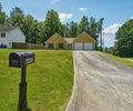 6445 Marsham Drive Atlanta, GA 30349 - Photo 3 of 28 a front view of a house with a yard