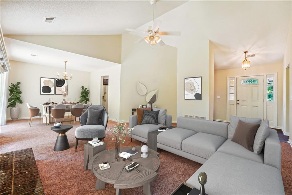 6445 Marsham Drive Atlanta, GA 30349 - Photo 10 of 28 a living room with furniture and wooden floor