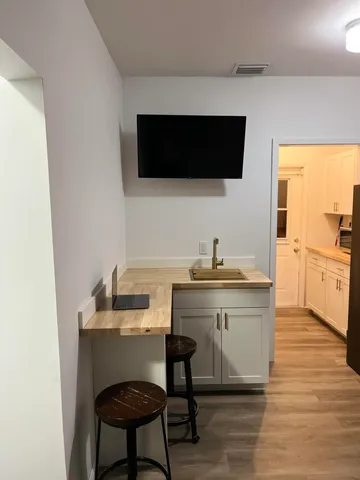 a kitchen with a sink and a microwave