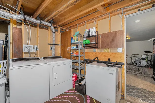 a view of a patio with table and chairs with wooden floor and fence