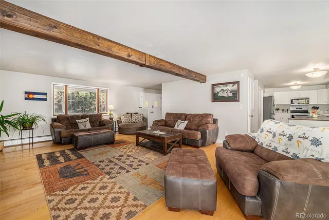 a living room with furniture and window