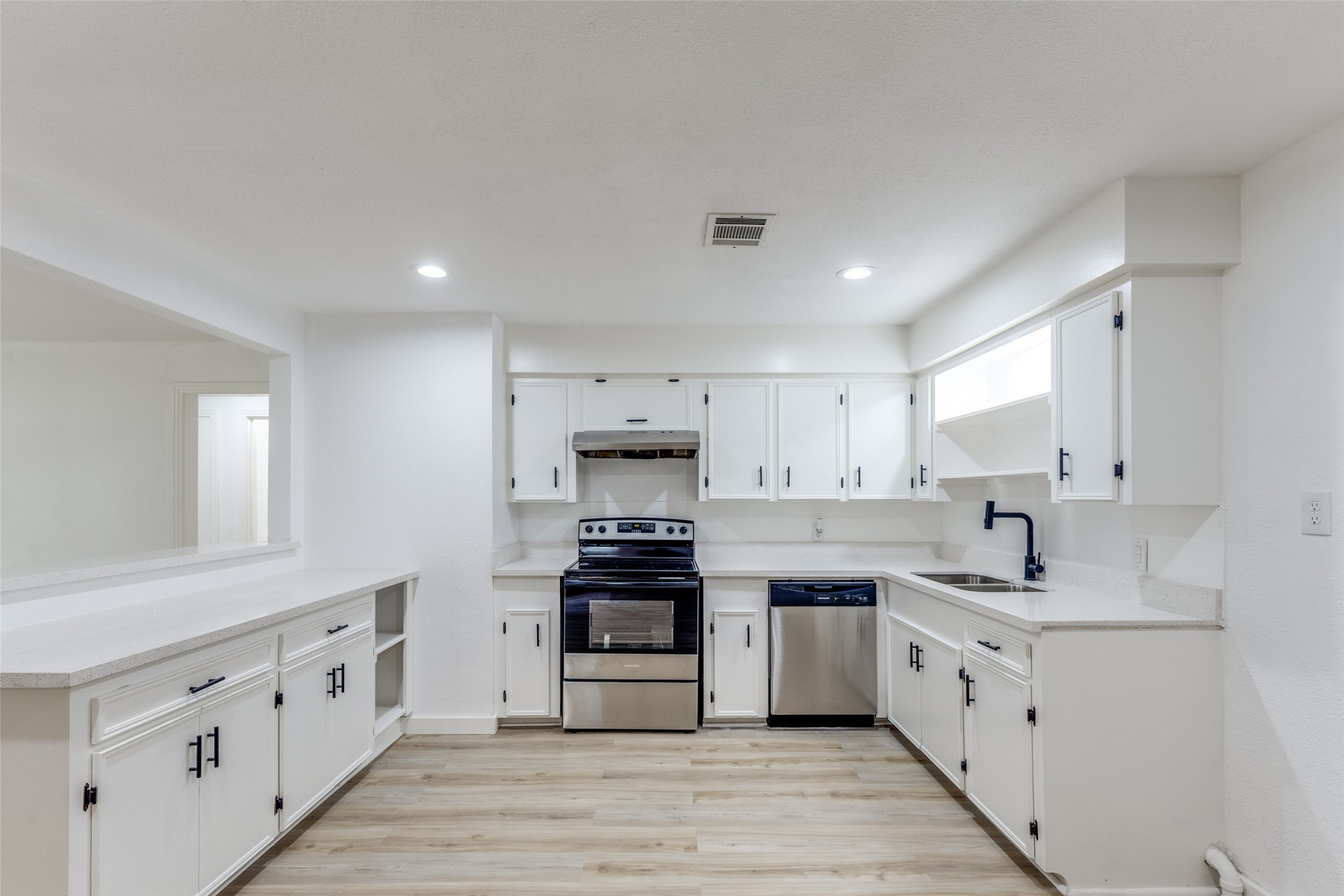 2545 Jackson La Marque, TX 77568 - Photo 12 of 30 a kitchen with white cabinets stainless steel appliances and sink