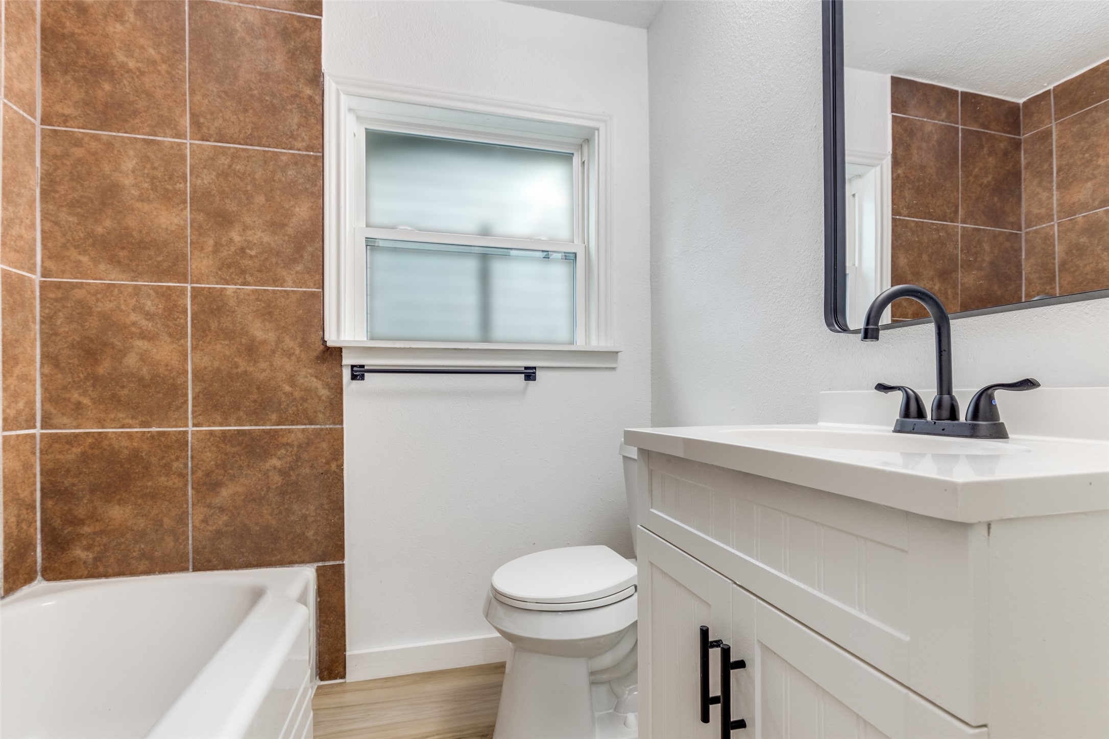 2545 Jackson La Marque, TX 77568 - Photo 14 of 30 a bathroom with a sink a toilet and shower