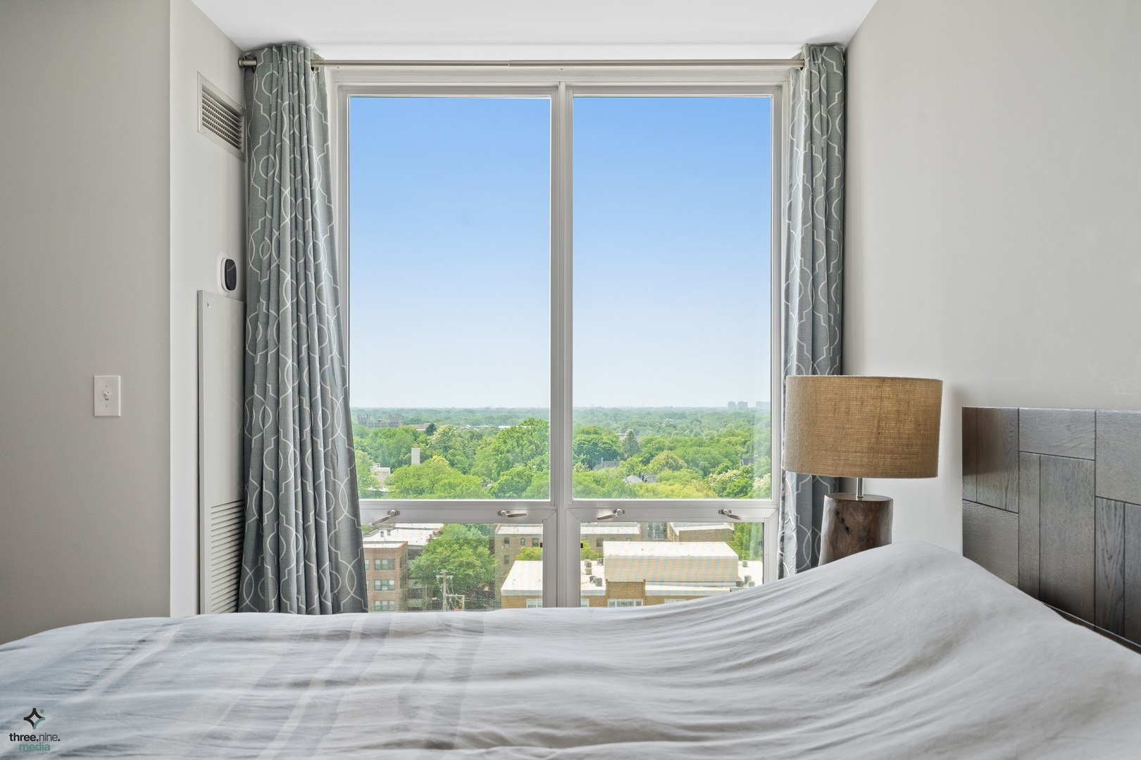 1640 Maple Avenue, Unit 1205 Evanston, IL 60201 - Photo 11 of 25 a bedroom with a bed and a large window