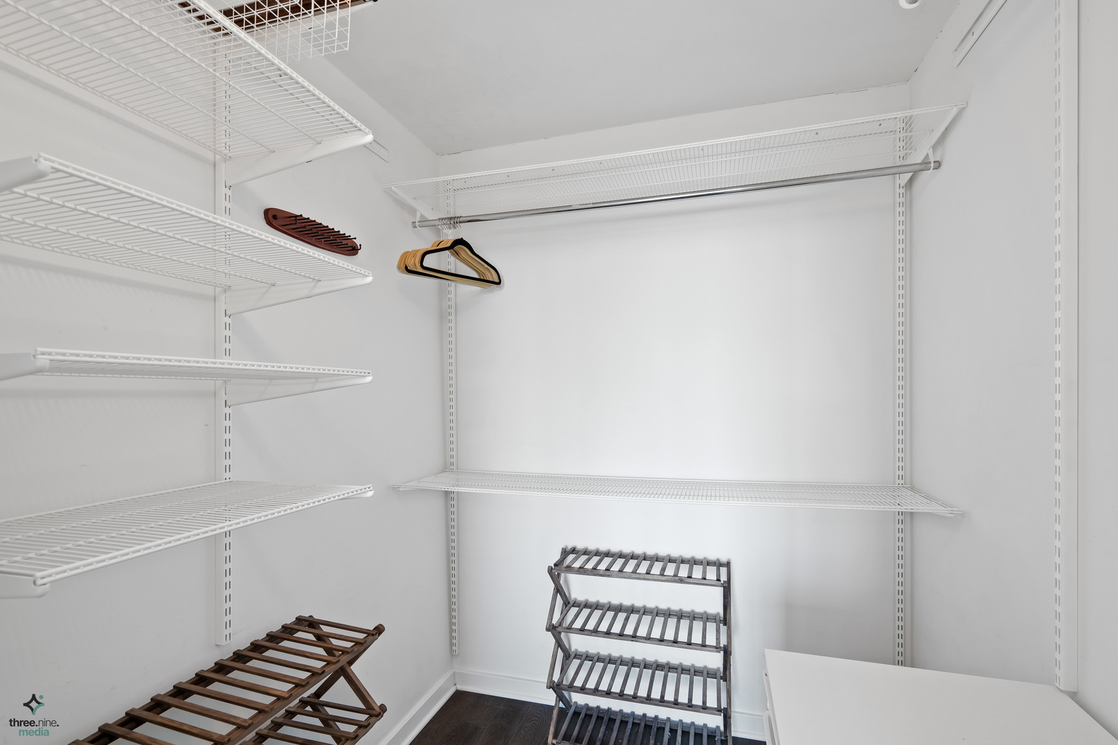 1640 Maple Avenue, Unit 1205 Evanston, IL 60201 - Photo 13 of 25 a hallway with a white cabinets and wooden floor