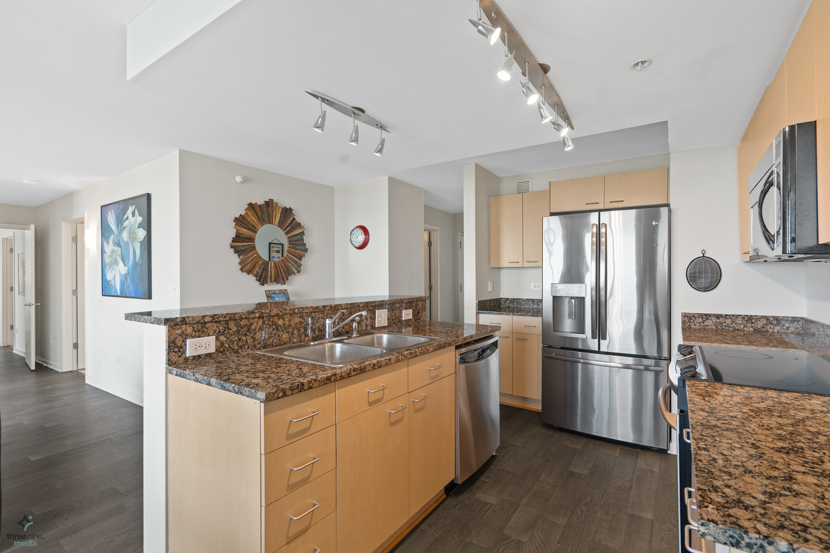 1640 Maple Avenue, Unit 1205 Evanston, IL 60201 - Photo 4 of 25 a kitchen with stainless steel appliances granite countertop a refrigerator and a stove