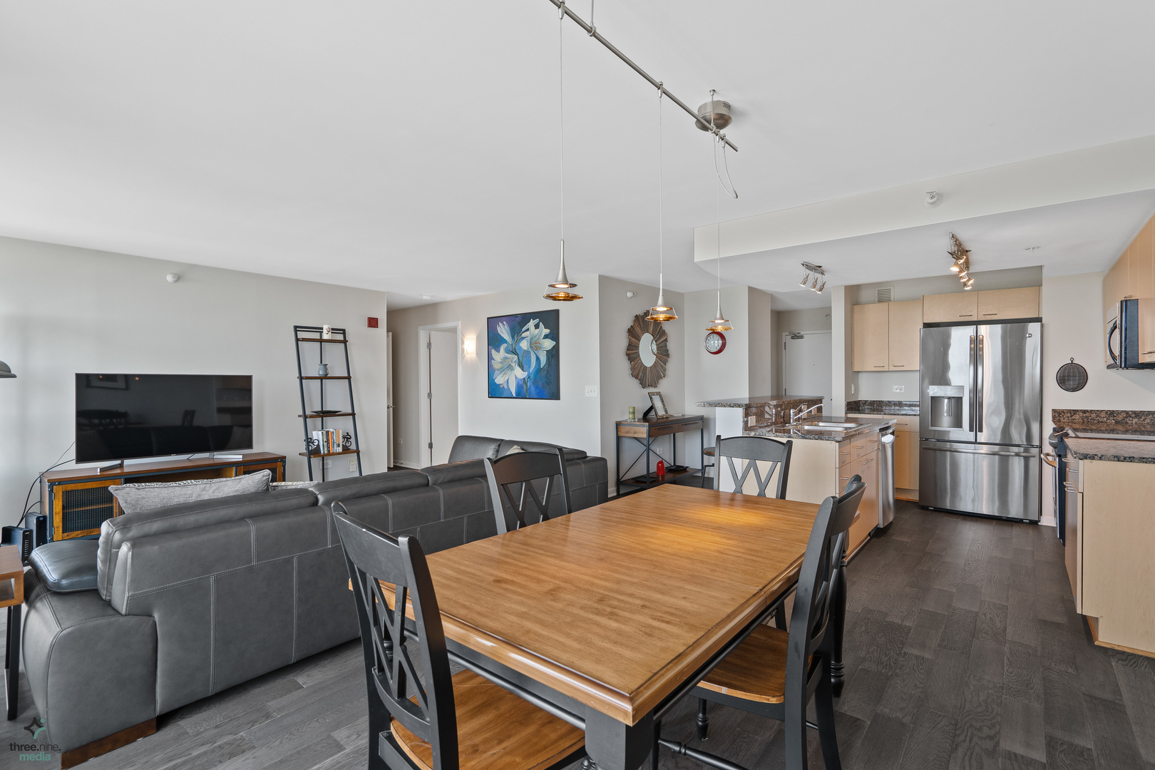 1640 Maple Avenue, Unit 1205 Evanston, IL 60201 - Photo 7 of 25 a view of a dining room with furniture and wooden floor