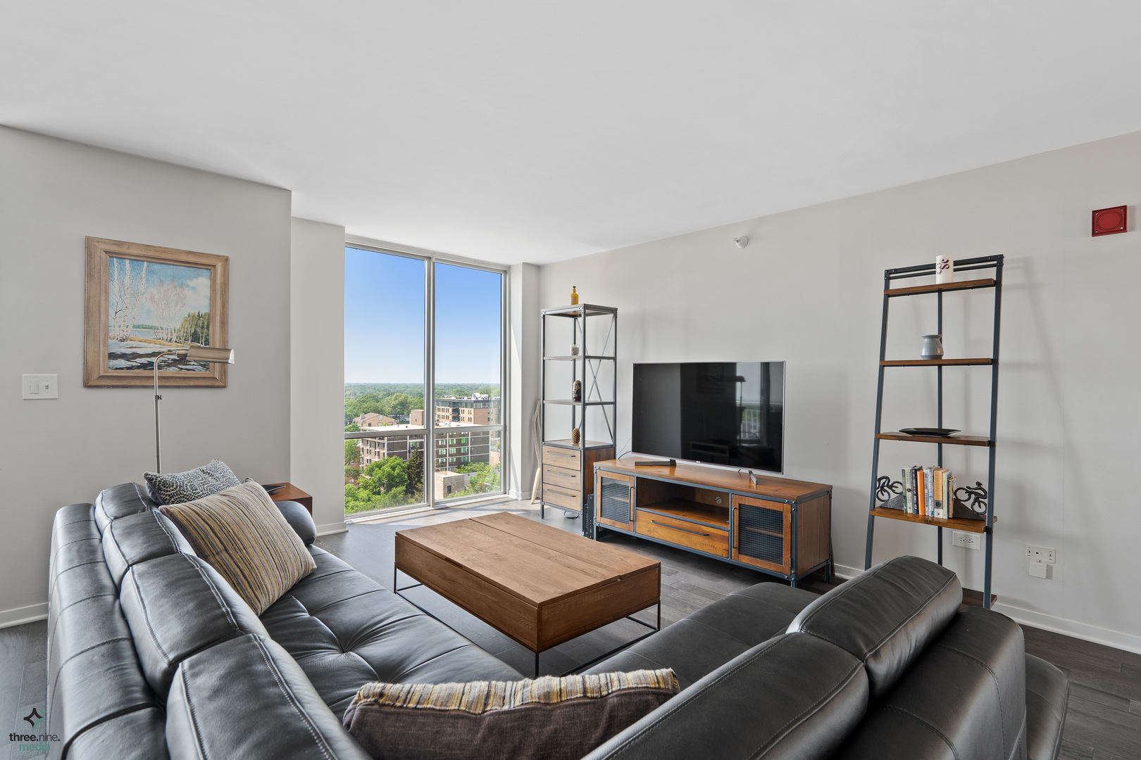 1640 Maple Avenue, Unit 1205 Evanston, IL 60201 - Photo 8 of 25 a living room with furniture a flat screen tv and a window