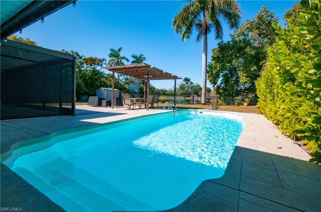 54 Liberty Lane Naples, FL 34112 - Photo 25 of 30 View of swimming pool with patio surround