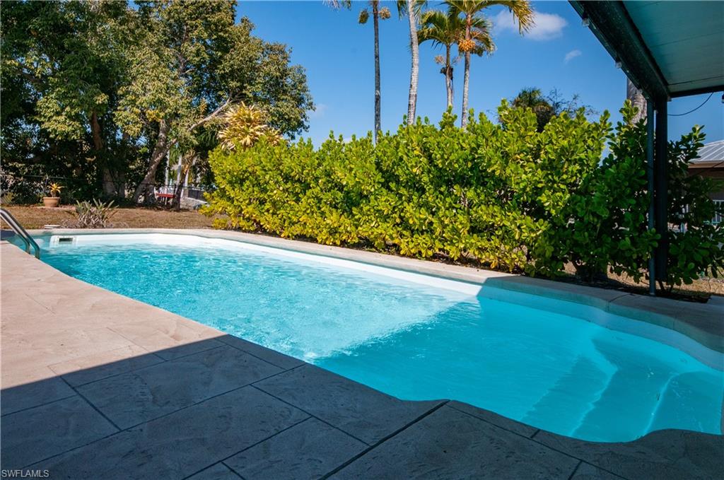 54 Liberty Lane Naples, FL 34112 - Photo 30 of 30 Outdoor pool featuring a patio area SALT WATER