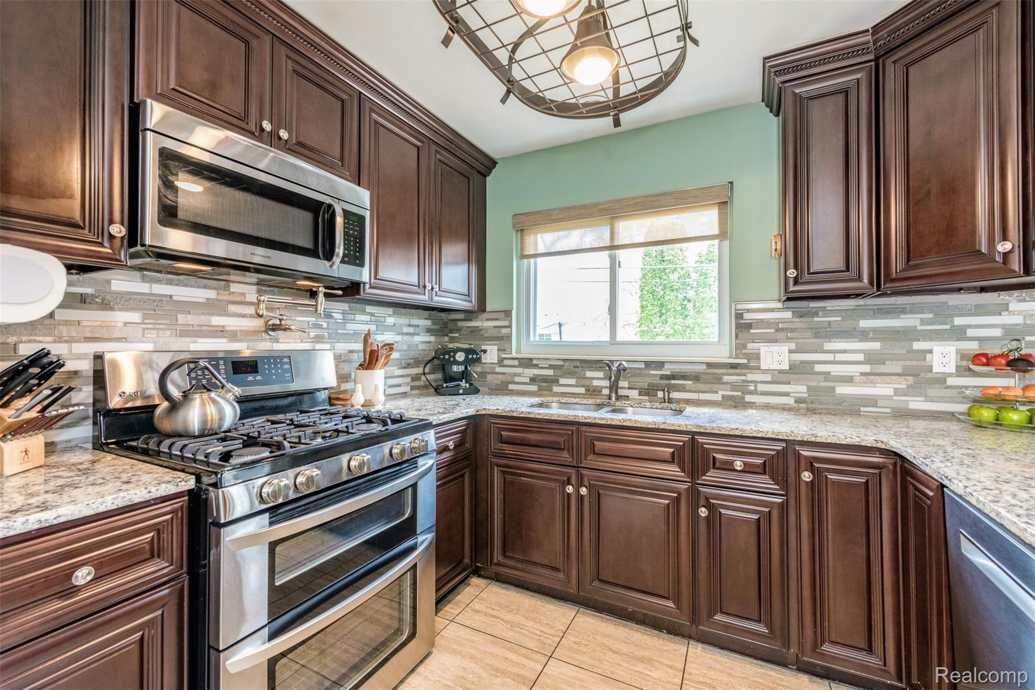 23434 Meadowbrook Road Novi, MI 48375 - Photo 11 of 29 Huge gas range and tons of cabinet space and stainless steel appliances