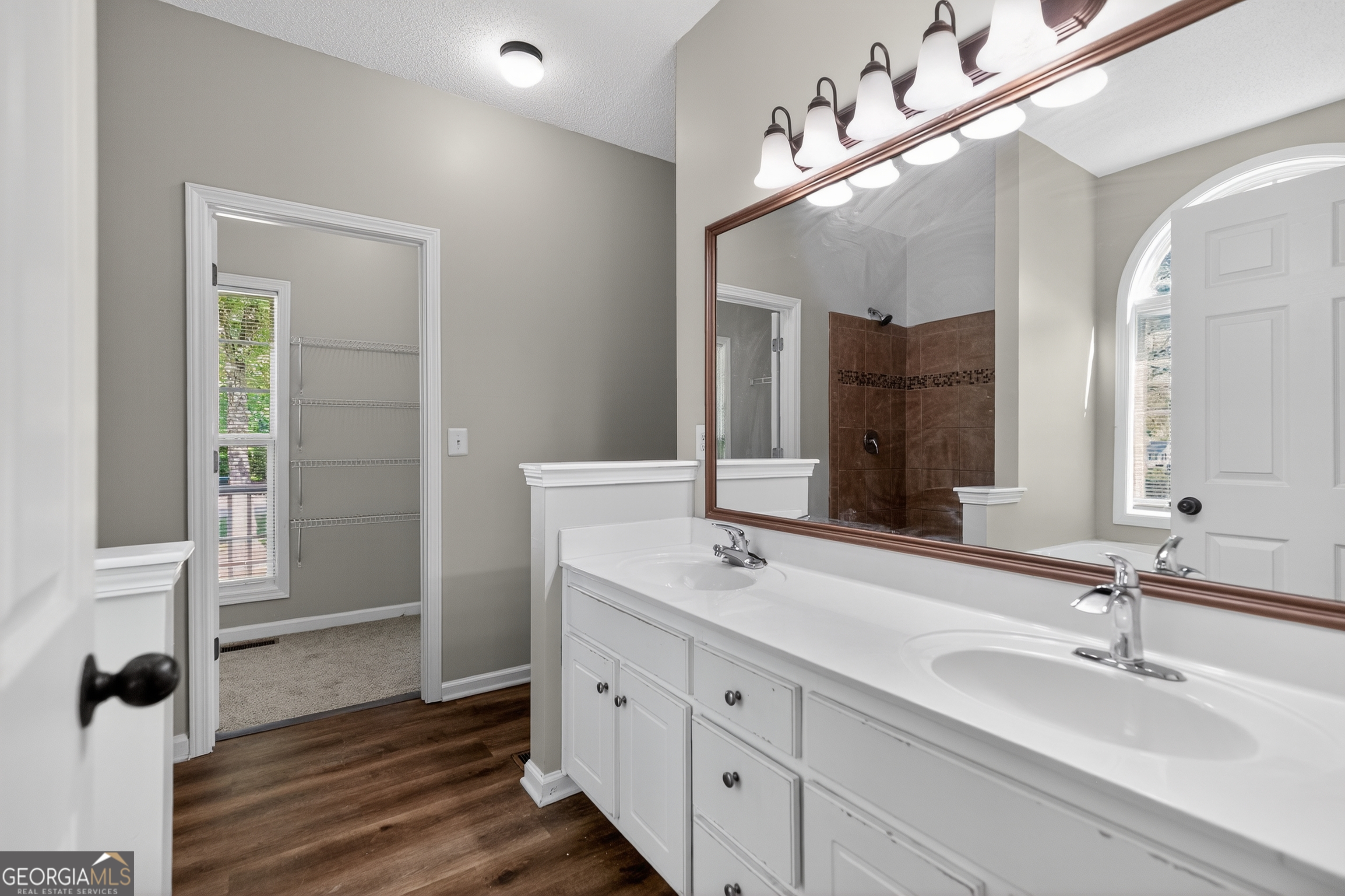 178 Rachel Boulevard Temple, GA 30179 - Photo 26 of 30 a bathroom with a double vanity sink and mirror