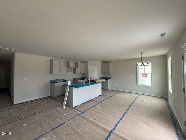 a view of a kitchen with a sink cabinets and window