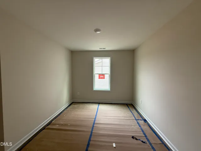 a view of a bedroom with window