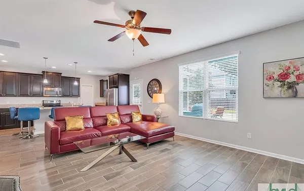a living room with furniture and a window