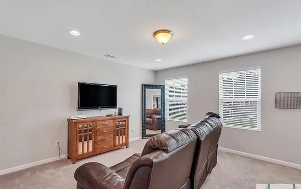 a view of a livingroom with a furniture