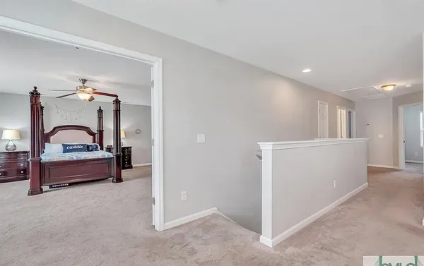a view of entryway and hall with wooden floor