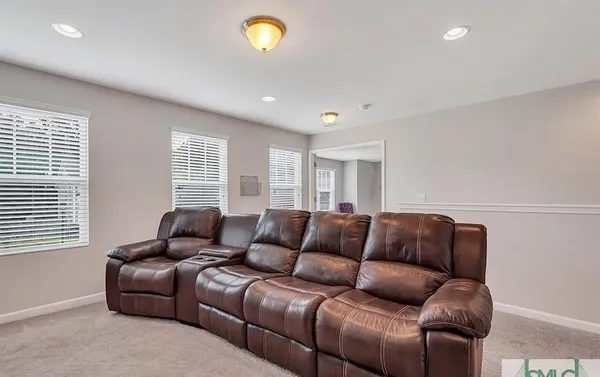 a bedroom with bed and a chandelier