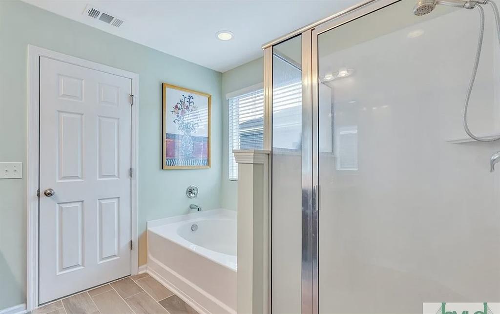 365 Southwilde Way Pooler, GA 31322 - Photo 37 of 50 a bathroom with a bathtub and a shower