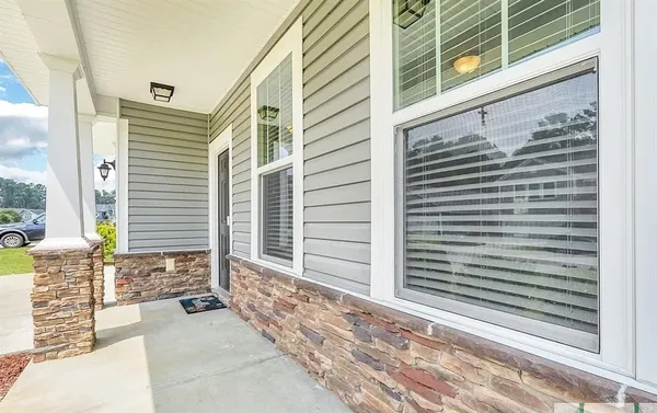 a view of a porch with a bench