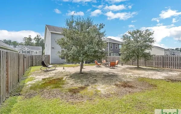 a house view with a seating space and deck