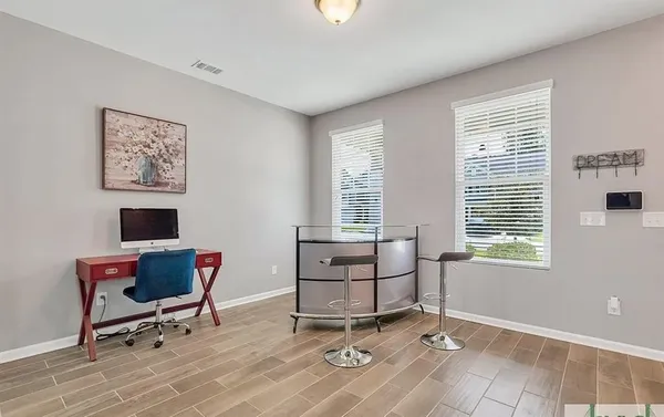 a workspace with furniture and a window