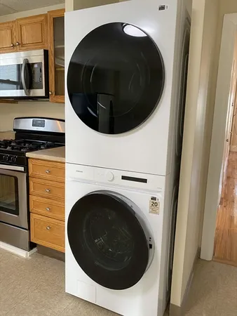 a utility room with washing machine and dryer