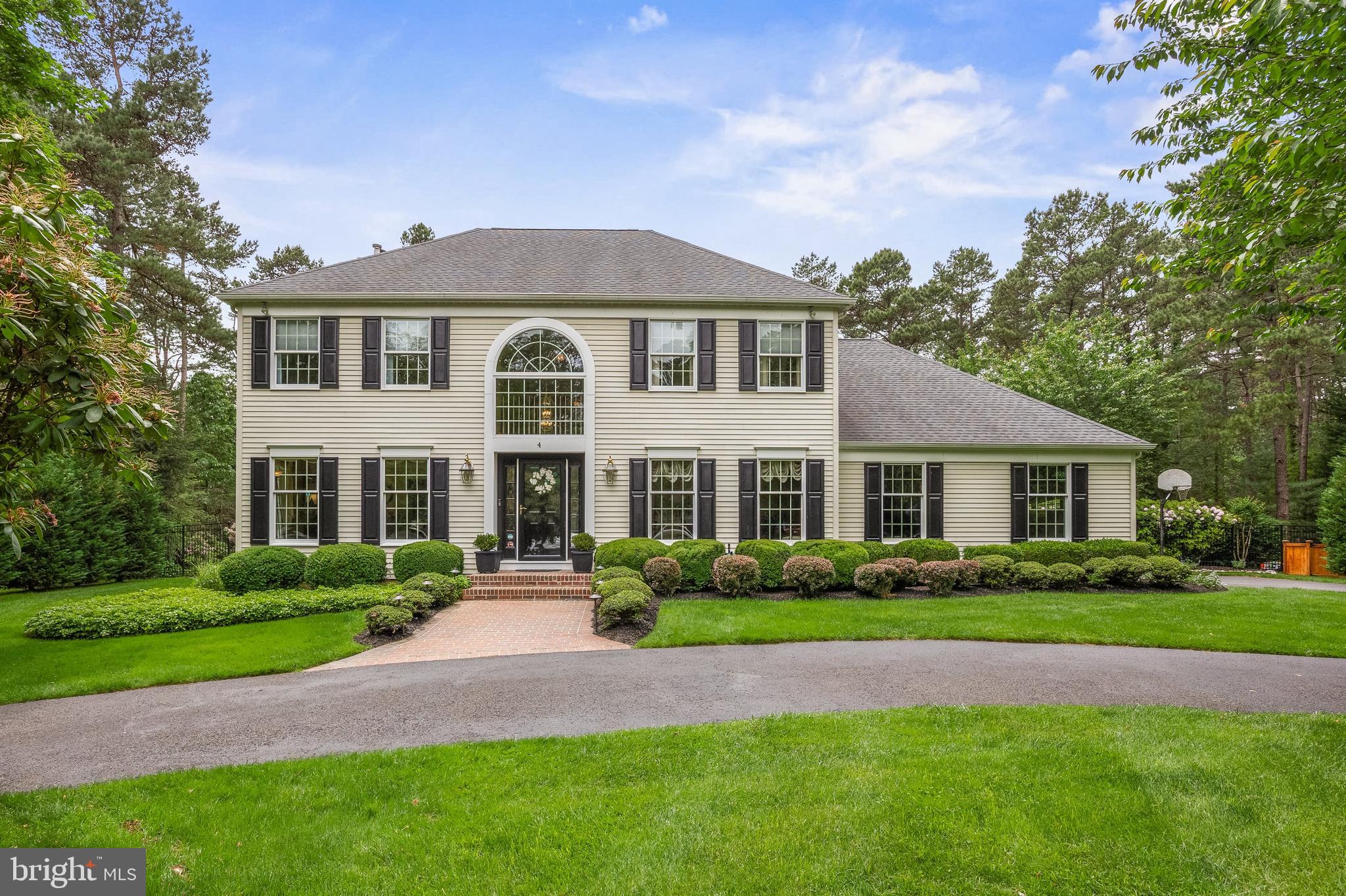 4 False Heather Way Medford, NJ 08055 - Photo 1 of 48 a front view of a house with a garden