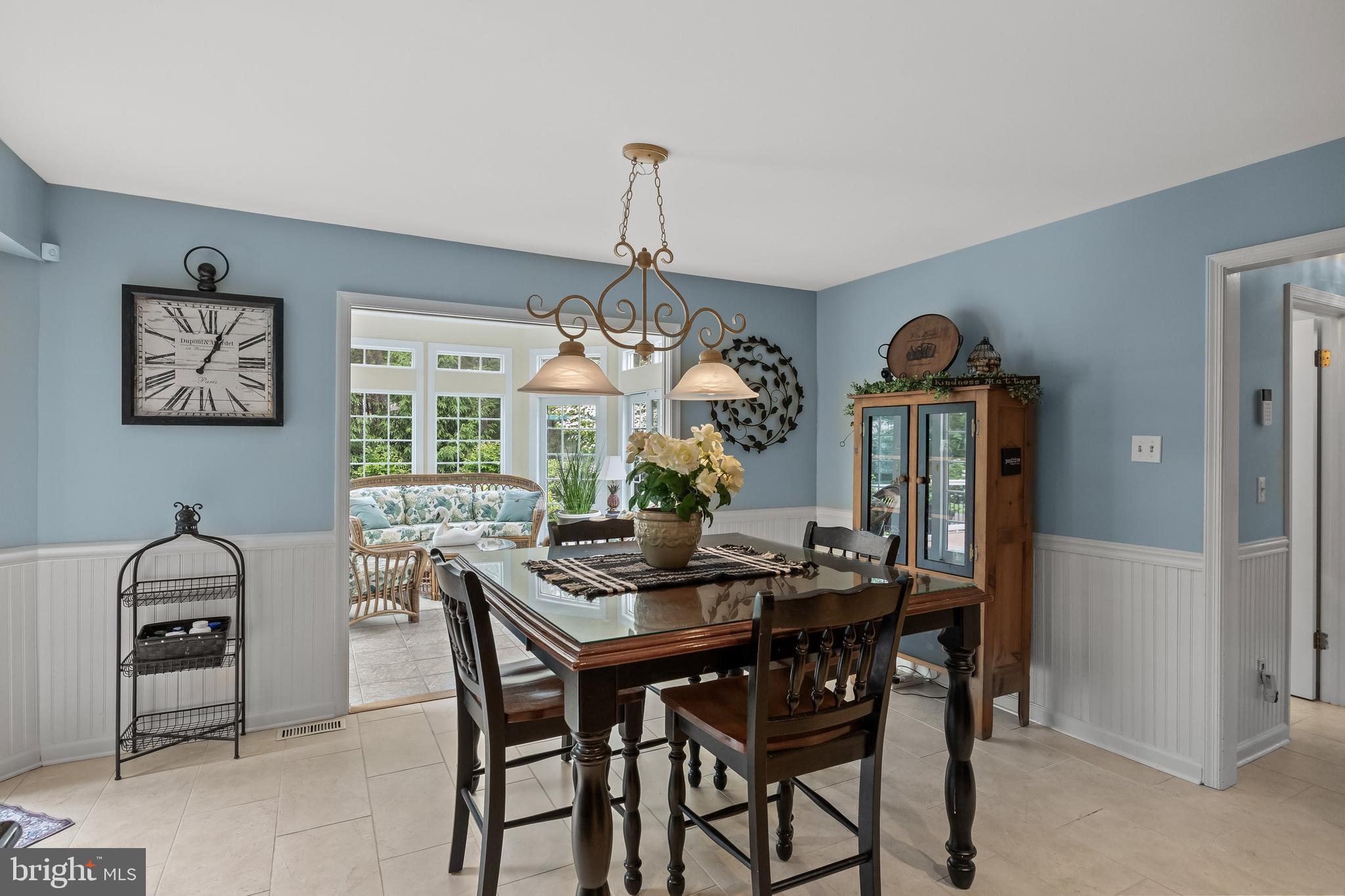 4 False Heather Way Medford, NJ 08055 - Photo 12 of 48 a dining room with a wooden table and chairs