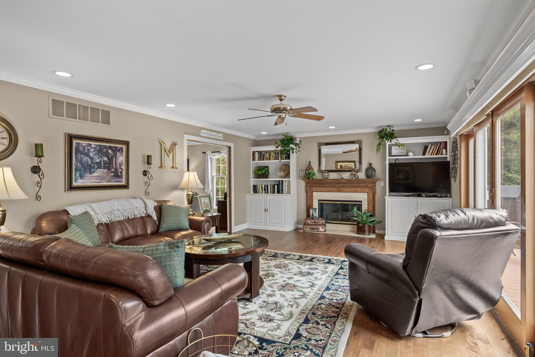 4 False Heather Way Medford, NJ 08055 - Photo 15 of 48 a living room with furniture a flat screen tv and a fireplace