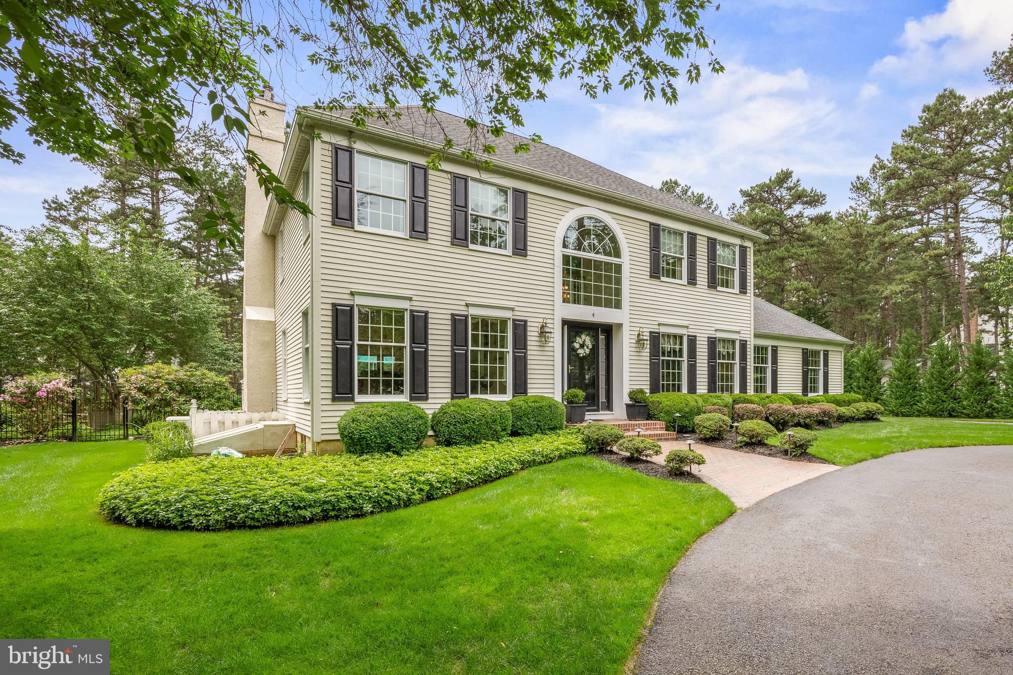 4 False Heather Way Medford, NJ 08055 - Photo 2 of 48 a front view of a house with a yard and porch