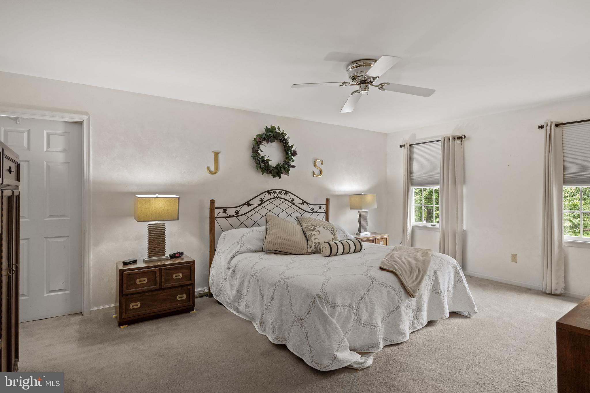 4 False Heather Way Medford, NJ 08055 - Photo 22 of 48 a bedroom with a bed and a chandelier