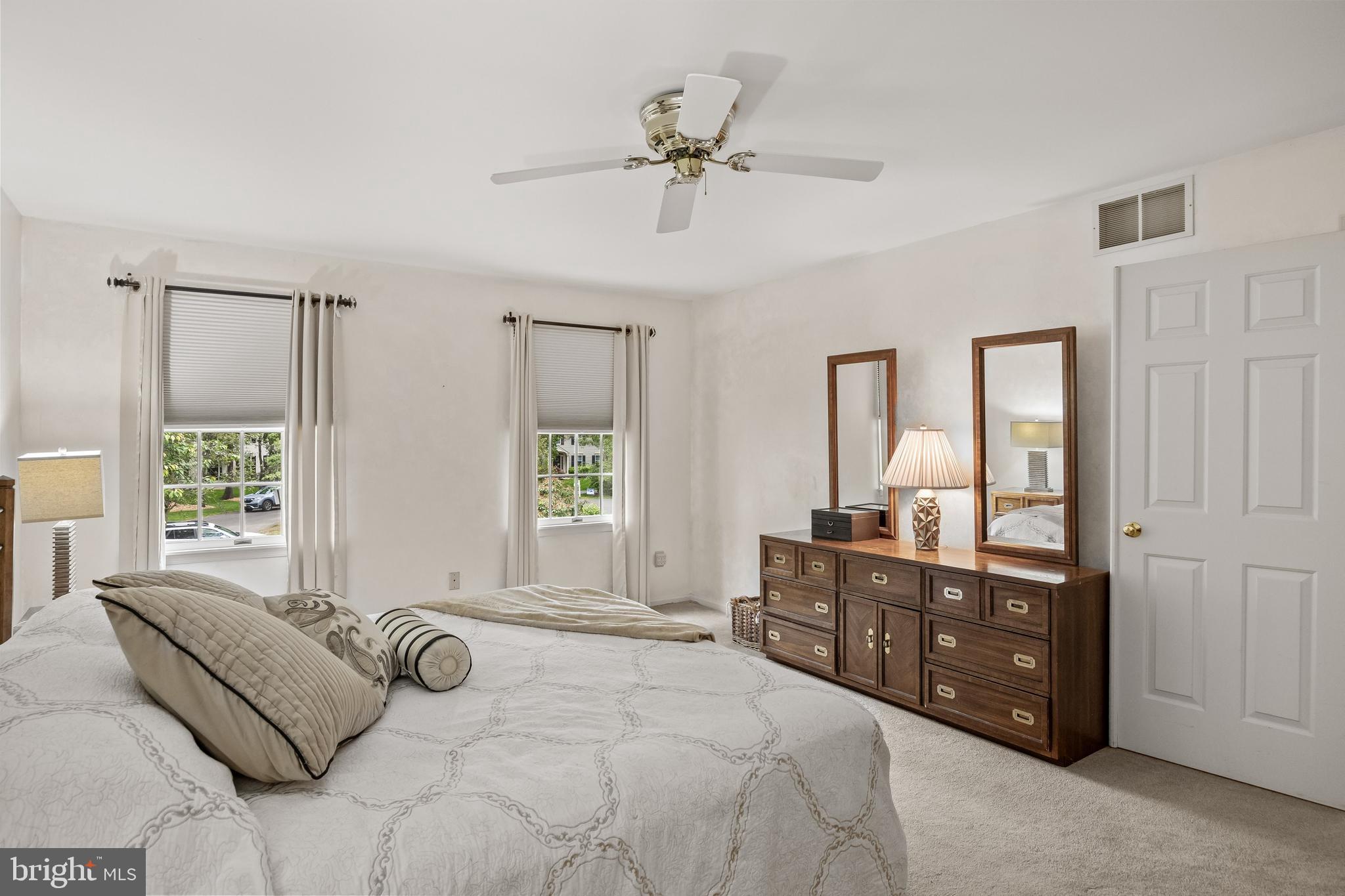 4 False Heather Way Medford, NJ 08055 - Photo 24 of 48 a bedroom with a bed a dresser and windows
