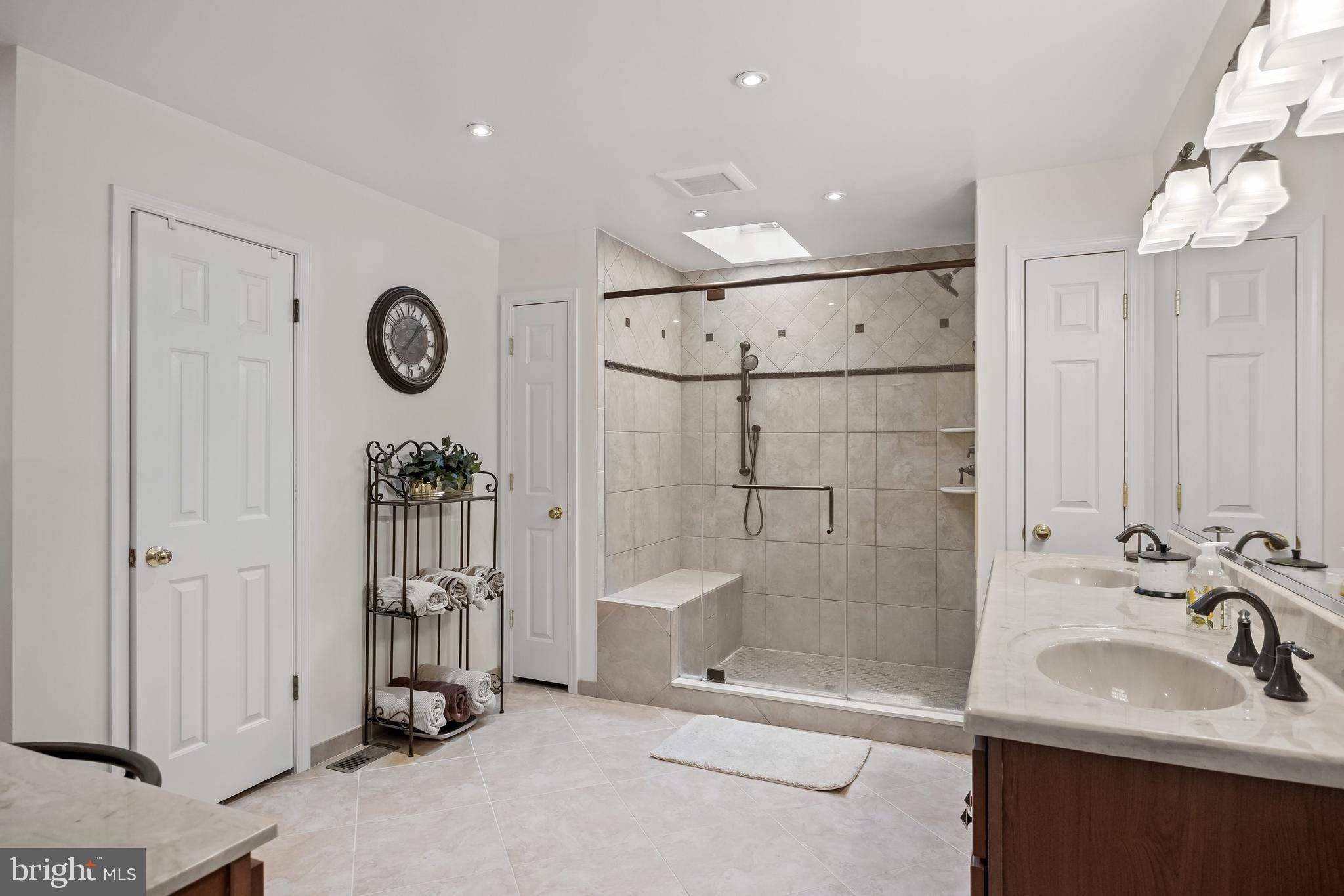 4 False Heather Way Medford, NJ 08055 - Photo 25 of 48 a bathroom with a sink a toilet and shower