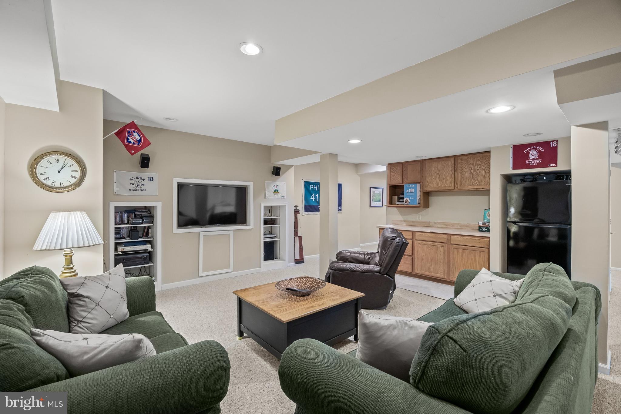 4 False Heather Way Medford, NJ 08055 - Photo 31 of 48 a living room with furniture and a flat screen tv