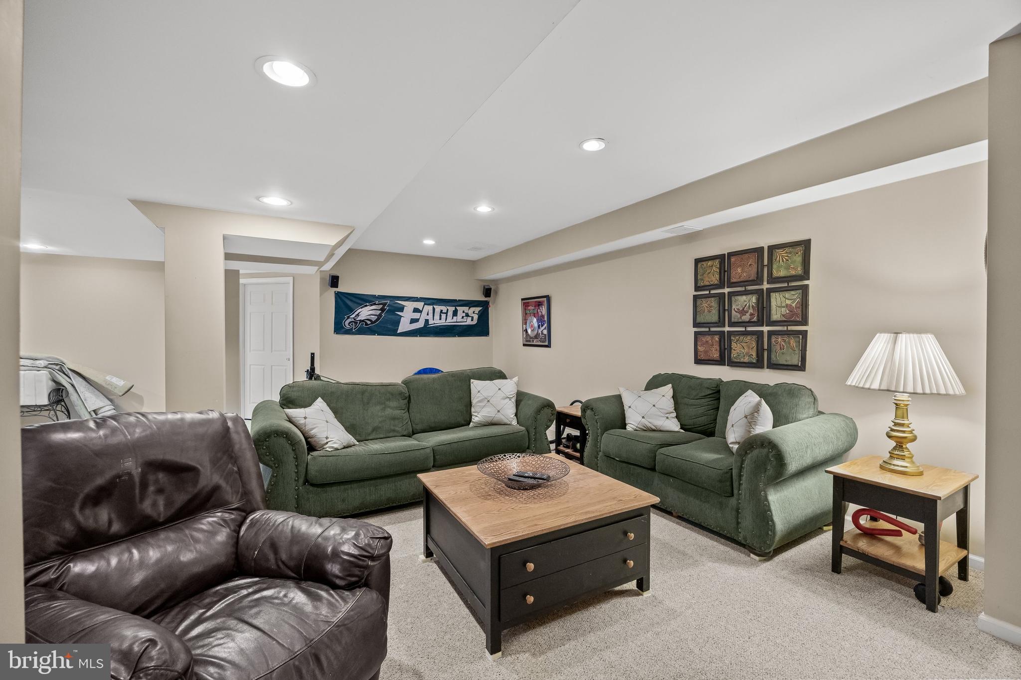 4 False Heather Way Medford, NJ 08055 - Photo 32 of 48 a living room with furniture and a lamp